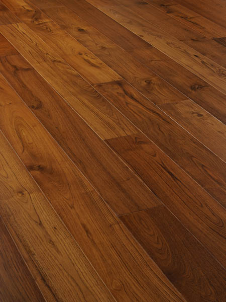 Warm brown oak planks photographed close up, with visible knots and strong grain.